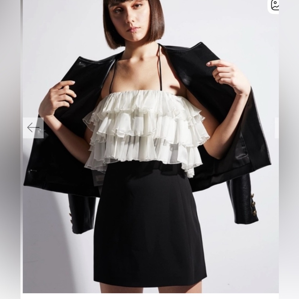 Alexis Dolci mini Dress. $625 retail. Black with ruffle detail on the bust.